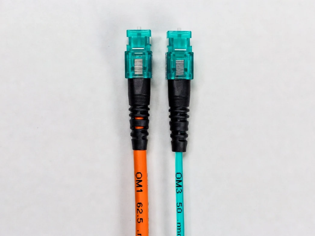Orange OM1 and Aqua OM3 multimode fiber optic patch cables highlighting the difference between 62.5 and 50 micron core diameters for 1000BASE-SX SFP compatibility Orange OM1 and Aqua OM3 multimode fiber optic patch cables highlighting the difference between 62.5 and 50 micron core diameters for 1000BASE-SX SFP compatibility